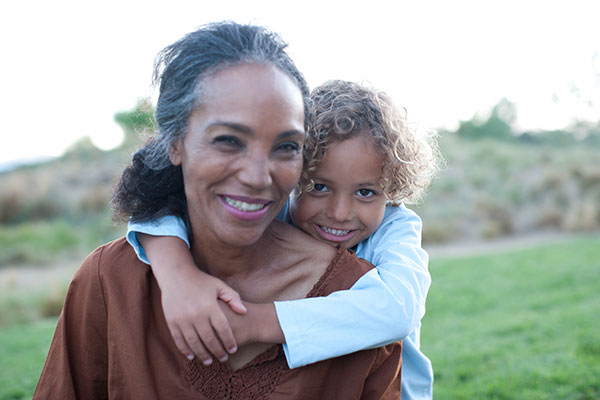 Boy hugging grandmother