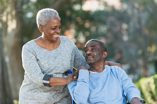 A senior African American couple taking a walk.